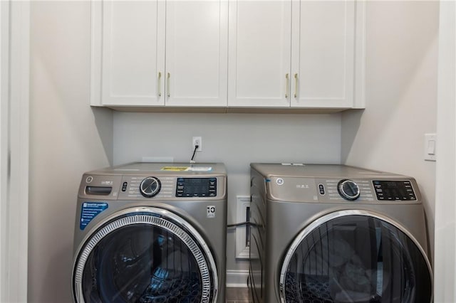 427 Burton Dr, Alpharetta, GA 30009 - laundry area featuring washing machine and clothes dryer and cabinet space