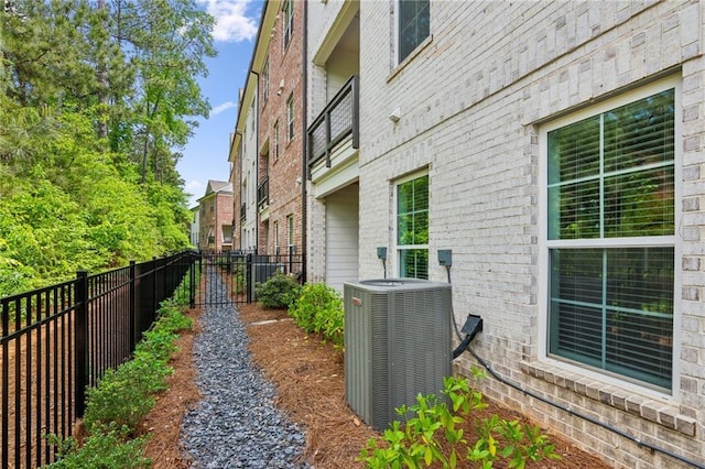 427 Burton Dr, Alpharetta, GA 30009 - view of side of property with central AC unit and brick siding