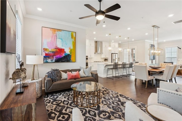 427 Burton Dr, Alpharetta, GA 30009 - living room featuring plenty of natural light, a ceiling fan, dark wood-type flooring, recessed lighting, and ornamental molding