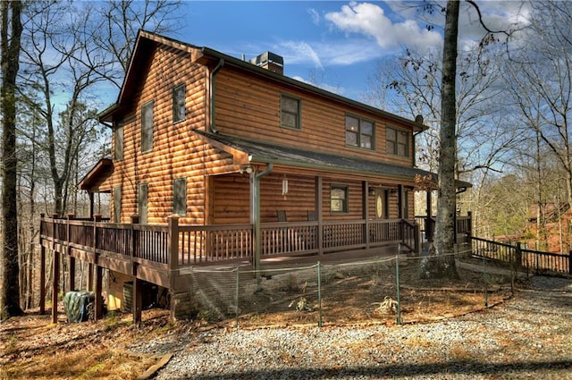 exterior space with a wooden deck and a porch