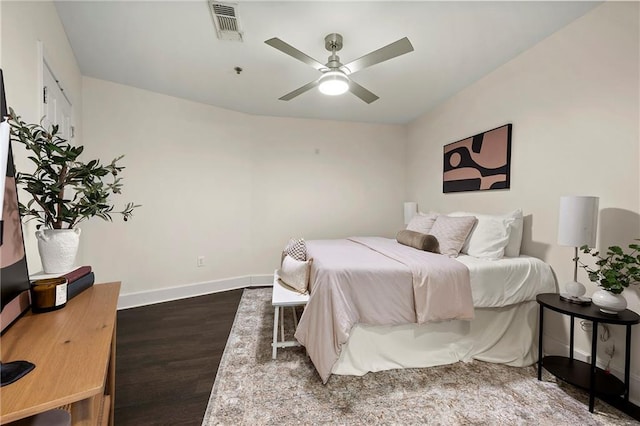 bedroom featuring ceiling fan and dark hardwood / wood-style flooring