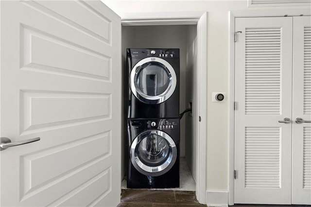 washroom with stacked washer / dryer