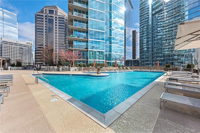 view of swimming pool featuring a patio area