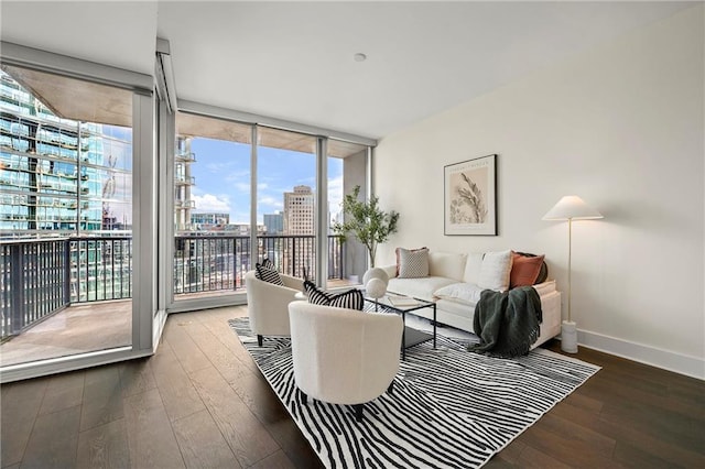 living room featuring floor to ceiling windows and dark hardwood / wood-style flooring