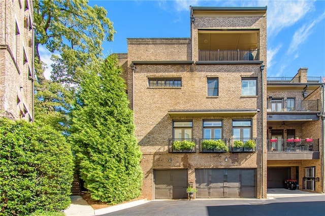 back of property featuring a garage