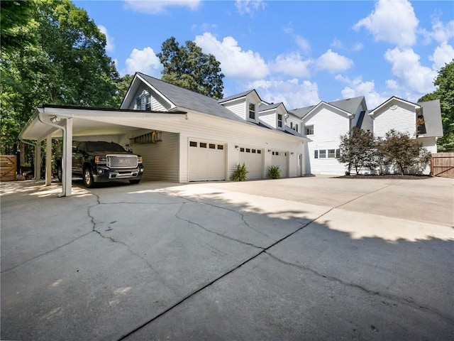 view of side of home featuring driveway