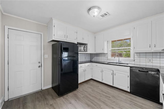 9 Latimer Rd, Cartersville, GA 30121 - kitchen featuring black appliances, a sink, light wood-style floors, white cabinets, and crown molding