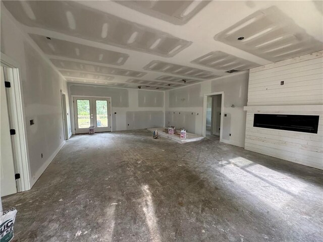 304 Cash Town Rd, Aragon, GA 30104 - unfurnished living room with a large fireplace and french doors