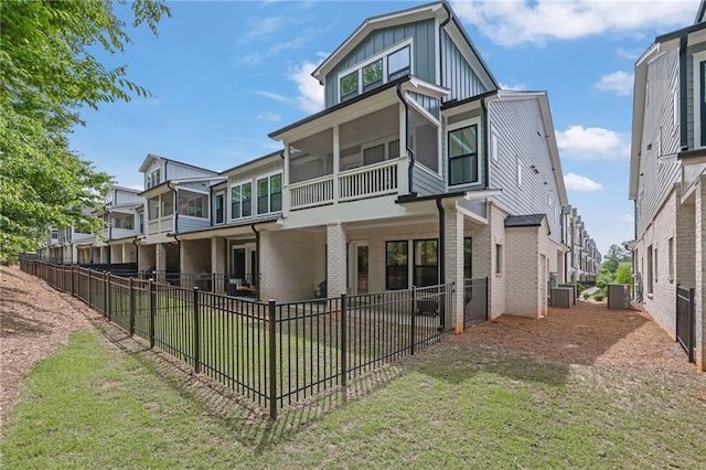 1110 Harper Dr, Roswell, GA 30076 - rear view of house with a fenced backyard, central AC unit, board and batten siding, and brick siding