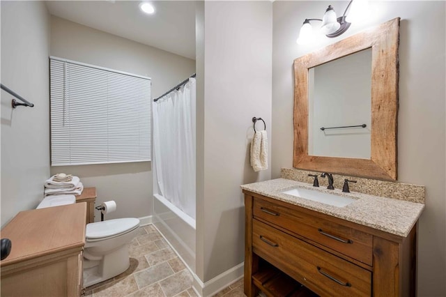 815 Spring View Ct, Covington, GA 30014 - bathroom featuring toilet, vanity, stone finish flooring, shower / tub combo with curtain, and baseboards