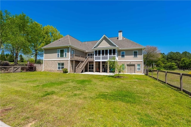 815 Spring View Ct, Covington, GA 30014 - back of house with a sunroom, stairs, a chimney, a garage, and brick siding