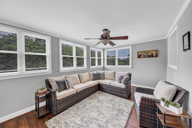 living room featuring ornamental molding, ceiling fan, and dark hardwood / wood-style flooring