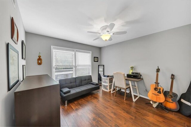 office with dark wood-type flooring and ceiling fan