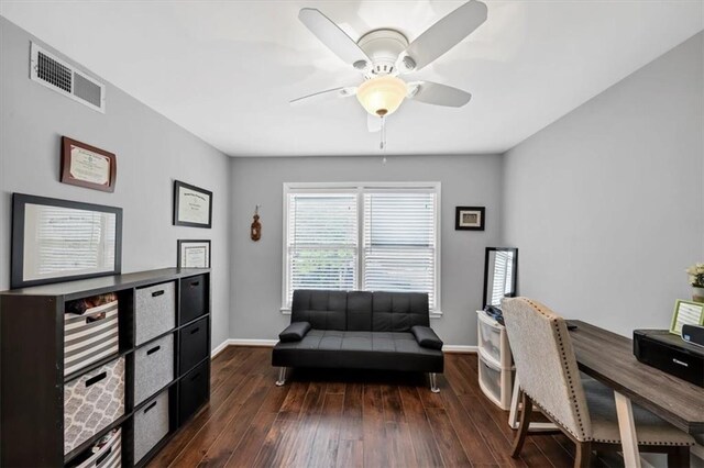 home office featuring dark hardwood / wood-style floors and ceiling fan