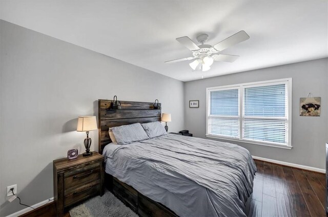 bedroom featuring ceiling fan and dark hardwood / wood-style flooring