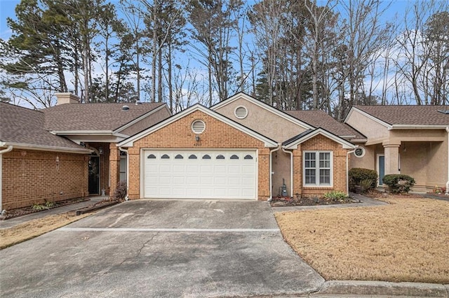 ranch-style house featuring a garage