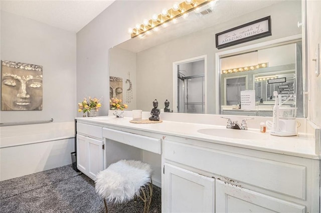 bathroom featuring vanity and shower with separate bathtub