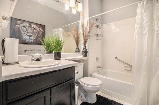 full bathroom featuring shower / tub combo with curtain, tile patterned flooring, vanity, and toilet