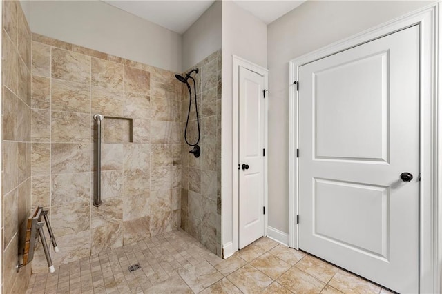 full bath featuring a tile shower
