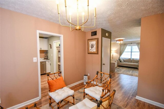 1235 Riverside Dr Unit H3, Gainesville, GA 30501 - living area with a textured ceiling, wood finished floors, and baseboards