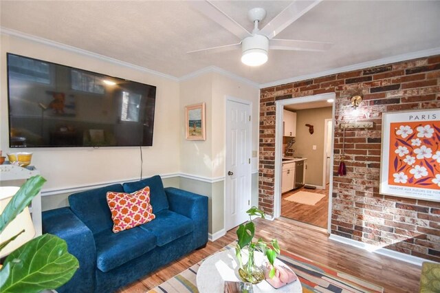 1235 Riverside Dr Unit H3, Gainesville, GA 30501 - living area featuring crown molding, light wood finished floors, ceiling fan, brick wall, and baseboards