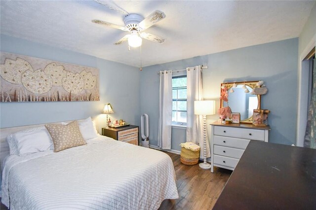 1235 Riverside Dr Unit H3, Gainesville, GA 30501 - bedroom with dark wood finished floors and a ceiling fan