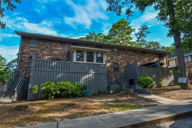 1235 Riverside Dr Unit H3, Gainesville, GA 30501 - view of front facade with stairs and brick siding