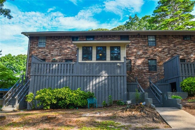1235 Riverside Dr Unit H3, Gainesville, GA 30501 - view of front of house featuring brick siding and stairs