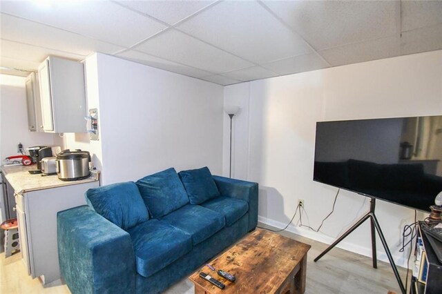 1235 Riverside Dr Unit H3, Gainesville, GA 30501 - living room with light wood-style floors, a drop ceiling, and baseboards