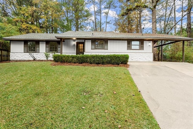 ranch-style house with a front yard and a carport