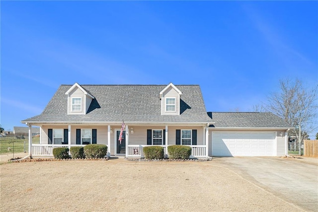 cape cod house featuring covered porch, driveway, roof with shingles, and a garage