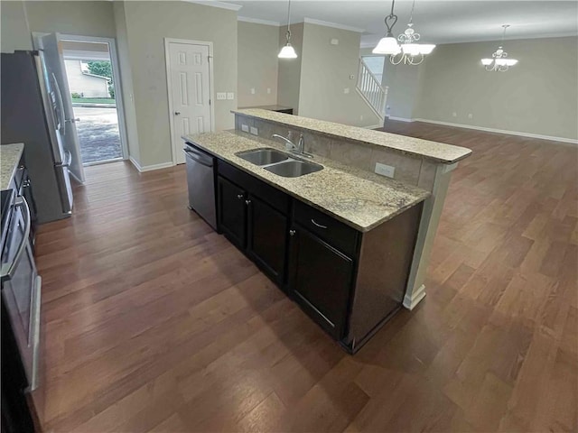 kitchen with a sink, black dishwasher, freestanding refrigerator, crown molding, and dark wood-style flooring