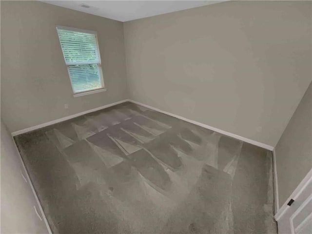 empty room with baseboards