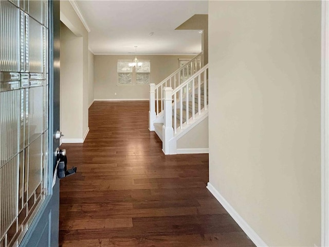 entrance foyer featuring stairs, an inviting chandelier, wood finished floors, and baseboards