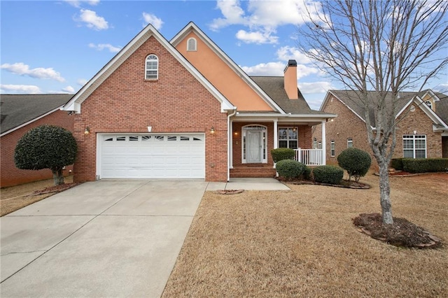 view of front property featuring covered porch and a garage