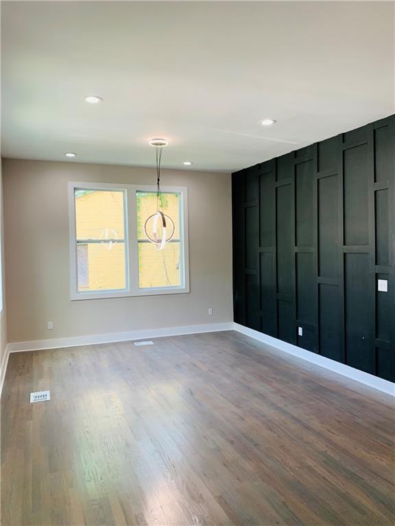 empty room with light hardwood / wood-style floors