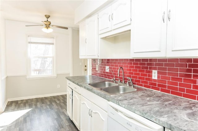 kitchen featuring dark wood-style flooring, a sink, white cabinetry, dishwasher, and tasteful backsplash