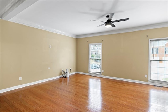 unfurnished room featuring ceiling fan, crown molding, light hardwood / wood-style floors, and a wealth of natural light