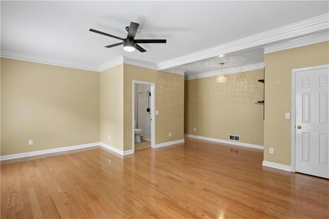 empty room with ceiling fan, light wood-type flooring, and crown molding