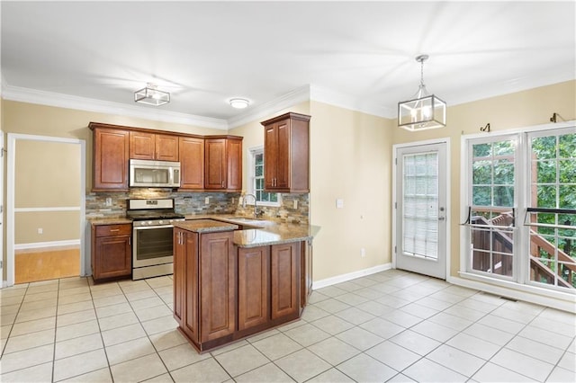 kitchen with light stone counters, sink, appliances with stainless steel finishes, decorative light fixtures, and ornamental molding