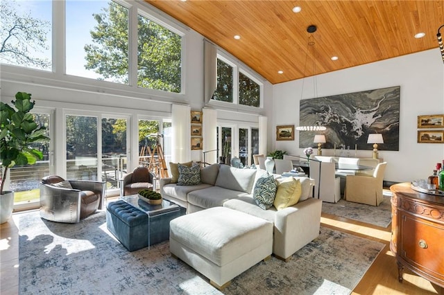 sunroom featuring wooden ceiling and french doors