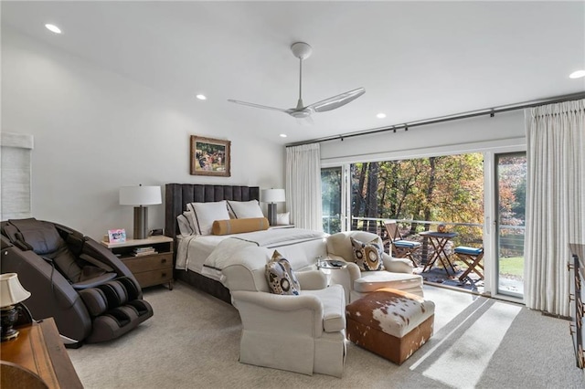 bedroom featuring access to exterior, multiple windows, light colored carpet, and ceiling fan