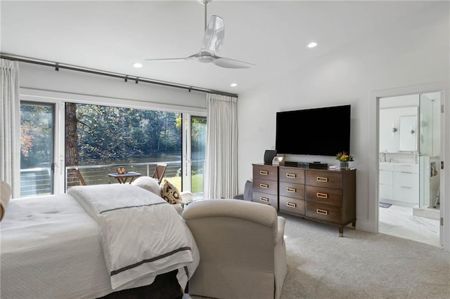 carpeted bedroom with access to exterior, ceiling fan, and ensuite bathroom