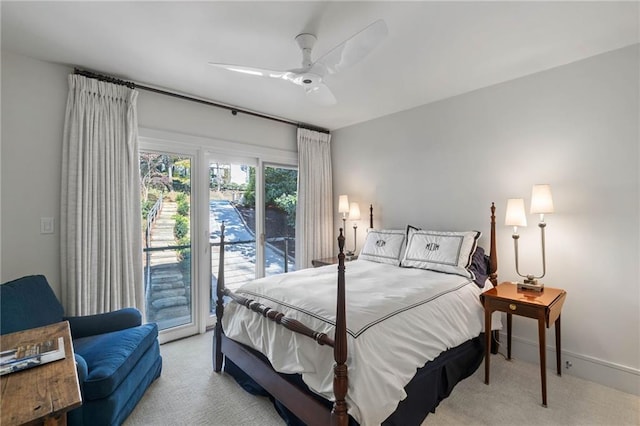 bedroom with light carpet, access to outside, and ceiling fan