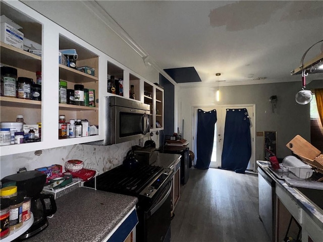 4018 Carisbrook Dr, Union City, GA 30291 - kitchen featuring appliances with stainless steel finishes, ornamental molding, dark wood-style floors, tasteful backsplash, and dark countertops