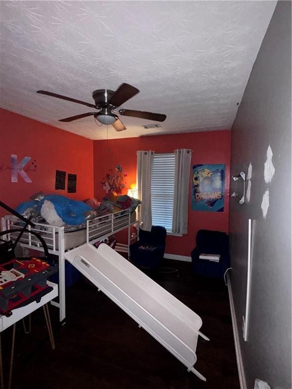 4018 Carisbrook Dr, Union City, GA 30291 - bedroom featuring a textured ceiling, a ceiling fan, and wood finished floors