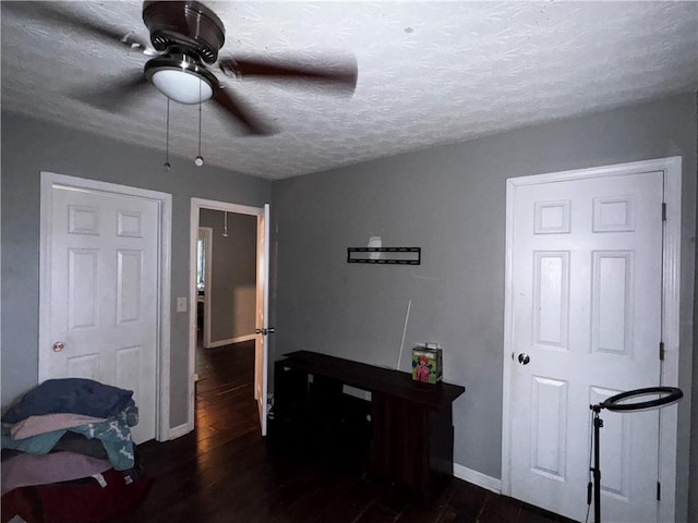 4018 Carisbrook Dr, Union City, GA 30291 - bedroom featuring dark wood-style floors, a textured ceiling, and ceiling fan