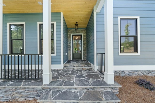 doorway to property with a porch