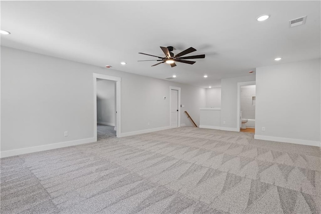 unfurnished room featuring recessed lighting, baseboards, a ceiling fan, and light colored carpet