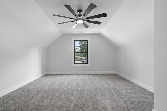 bonus room with carpet flooring, lofted ceiling, baseboards, and a ceiling fan